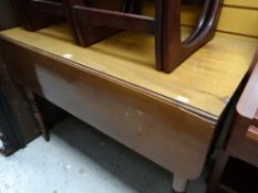 An antique mahogany drop flap table