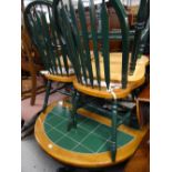 A circular / oval tile top kitchen table & four chairs