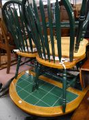 A circular / oval tile top kitchen table & four chairs