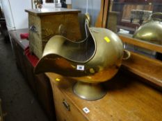 A brass helmet coal scuttle