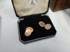 A boxed pair of 9ct gold cufflinks