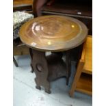 A copper top pub table with lower tier in an Arts & Crafts-style