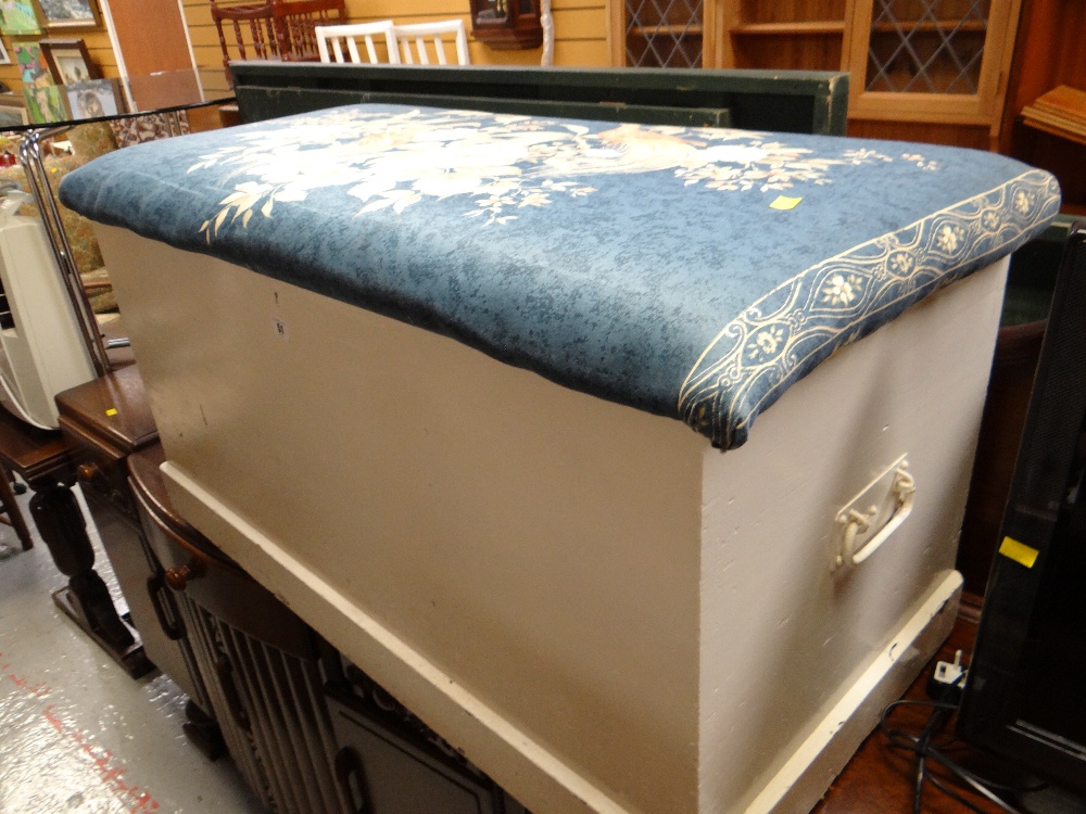 A white painted pine cushion-top blanket-chest