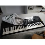 A Yamaha Portatone electric keyboard E/T