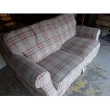 A tartan upholstered sofa bed