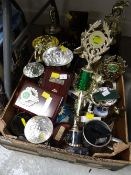 A box of various sports trophies