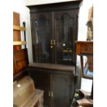 A stained early twentieth century bookcase cupboard