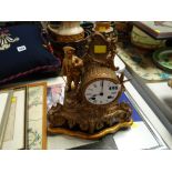 A reproduction gilt French-style mantel clock