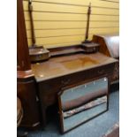 An Edwardian mahogany & inlaid dressing table with two short drawers above one long & two drawer