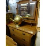 A vintage three-drawer mirror back dressing table