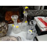 Three decanters including Edinburgh crystal