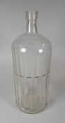 A VINTAGE CLEAR GLASS BOTTLE MARKED 'POISON', 34cms high (BBC Bargain Hunt)