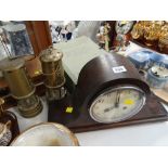 A vintage Napoleon hat mahogany mantel clock together with two reproduction miners lamps