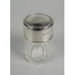 A FACETED GLASS & SILVER SCENT BOTTLE with original interior stopper, the silver lid with monogram