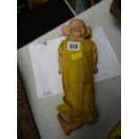 A late nineteenth century straw filled doll of the American comic character 'The Yellow Kid' (