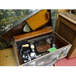 A vintage Singer sewing machine in a case