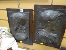 Two continental metal relief plaques, head & shoulders of two males