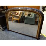 A good gilt & ebonized carved overmantel mirror