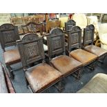 A set of six antique arch topped high backed dining chairs with back panels believed to be carved