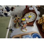 A modern Churchill Westminster chime mantel clock together with two continental figures