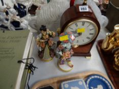 A modern Churchill Westminster chime mantel clock together with two continental figures