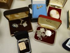 A parcel of silver & white metal cuff links, 9ct gold earrings, cameo brooches etc