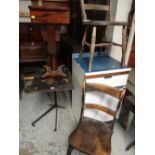 An antique adjustable reading table & two wooden chairs