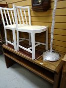 A modern two-tier side table & two white painted kitchen chairs