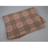 A VINTAGE WOOL WELSH BLANKET typically patterned in pink and green geometric check (BBC Bargain