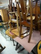 A mahogany oval extending dining table & six splat back antique dining chairs