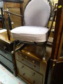 A vintage four-drawer chest & upholstered rocking chair