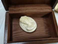 An ivory cameo & set of believed ivory napkin rings
