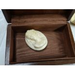 An ivory cameo & set of believed ivory napkin rings