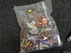 A large parcel of costume jewellery, bangles, necklaces etc