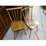 A pair of spindle back Ercol chairs