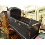 A nineteenth century stained wooden rocking crib