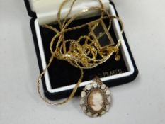 A 9ct gold boxed diamond pendant, 9ct gold neck chain & 9ct cameo pendant