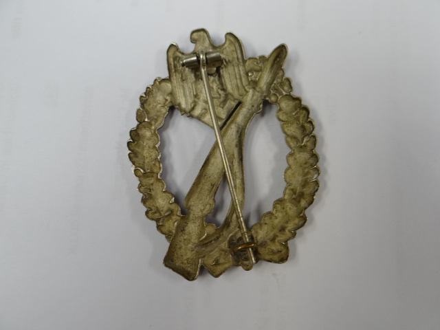 A parcel of Third Reich memorabilia, a bronze eagle on swastika, iron cross etc - Image 5 of 5