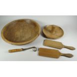 A PARCEL OF FARMHOUSE TREEN comprising bowl, 37cms diam, butter-worker, butter-curler and two