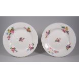 A PAIR OF NANTGARW PORCELAIN PLATES of plain non-moulded form & decorated with five sprays of