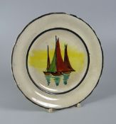 A LLANELLY TEA-PLATE decorated with sailing-boats by Shufflebotham within black borders, 17cms diam