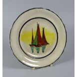 A LLANELLY TEA-PLATE decorated with sailing-boats by Shufflebotham within black borders, 17cms diam