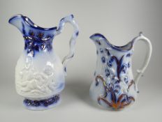 TWO YNYSMEUDWY JUGS (attributed to) being a narrow necked cherubic decorated example, 20cms high and