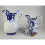 TWO YNYSMEUDWY JUGS (attributed to) being a narrow necked cherubic decorated example, 20cms high and