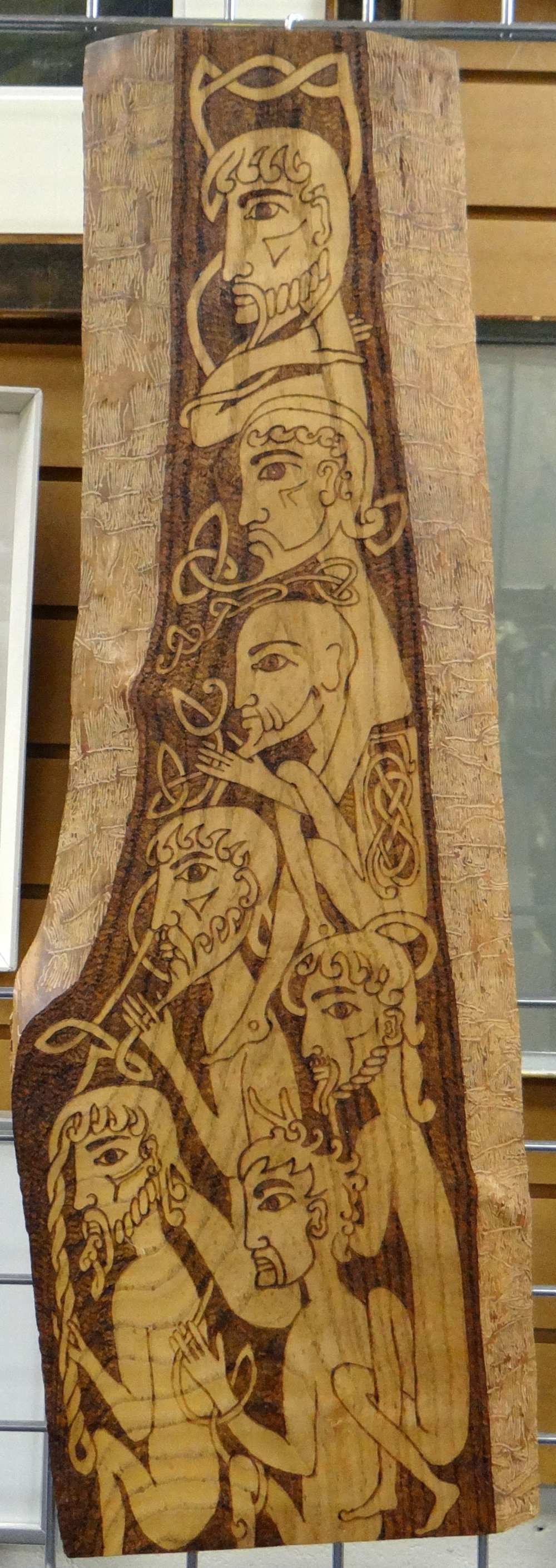 LESLEY LANMAN wood carved panel with poker-work - series of heads and bodies intertwining with