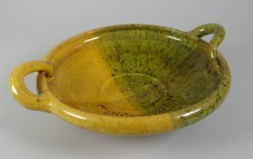AN EWENNY POTTERY FRUIT DISH with twin loop-handles, two-tone mottled glaze, the interior