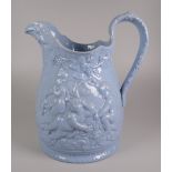AN YNYSMEUDWY JUG (attributed to) in blue glazed with relief decoration of frolicking cherubs in a
