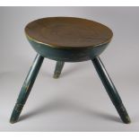 A PAINTED WELSH FARMHOUSE STOOL with turn decoration to the legs and seat, 33cms high