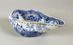 A RARE BEVINGTON PERIOD SWANSEA POTTERY PAP-BOAT with the blue and white 'Harper' transfer featuring