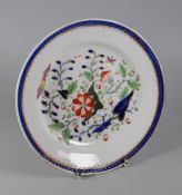 A SWANSEA PORCELAIN JAPAN PATTERN PLATE having a centre of stylised flowers in rust, gros-bleu and